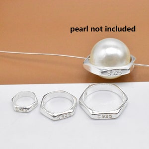 May include: Three silver rings with a hexagonal shape and the inscription "S925" on each. A larger silver ring with a hexagonal shape and the inscription "S925" is shown with a white pearl in the center. The text "pearl not included" is written above the ring.