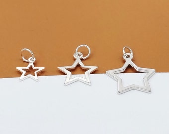 May include: Three silver star-shaped charms with open centers. The charms are different sizes and are perfect for jewelry making.