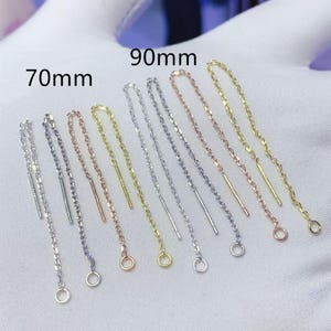 May include: Assortment of earring chain extenders in silver, gold, and rose gold. The chains are available in two lengths: 70mm and 90mm.