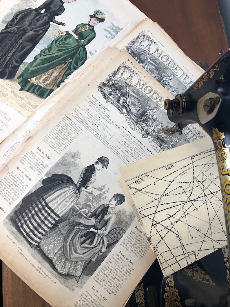 May include: A vintage sewing pattern from La Mode Illustree, a French fashion magazine. The pattern is for a dress with a striped skirt and a fitted bodice. The magazine cover features a woman in a green dress with a black jacket.