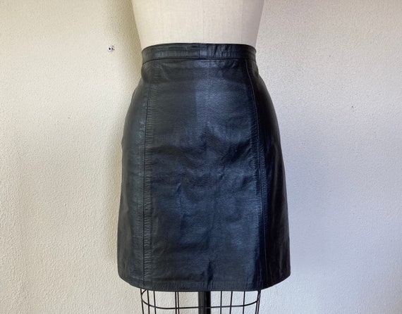 1980s Black leather mini skirt