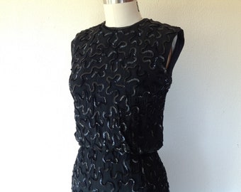 1960s black rayon dress with sequined squiggles