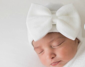 white newborn hat with bow