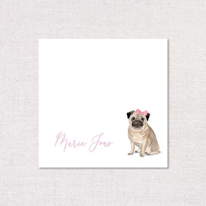 May include: A white card with a pink bow on a pug dog illustration and the text "Marie Jones" in pink cursive.