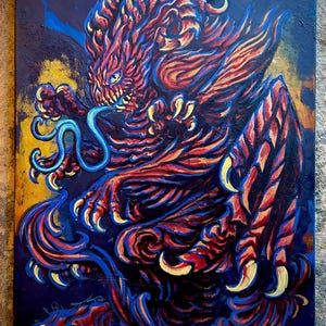 May include: A painting of a red and blue mythical creature with sharp claws and a long tongue. The creature is depicted in a dynamic pose, with its claws extended and its tongue flicking out. The background is a dark blue and gold color.