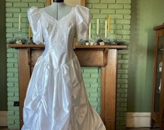 New, white satin and lace 1980s wedding dress