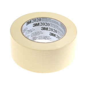 May include: A roll of 3M 2020 Masking Tape. The tape is beige and has a white label with the 3M logo and product name.