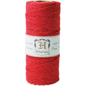 May include: A spool of red hemp twine, 100% natural, with a label that reads "Hemptique" and "100% Grade A Hemp Cord".