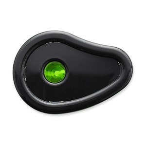 May include: Black pencil sharpener with a green plastic insert. The sharpener has a rounded, oval shape.