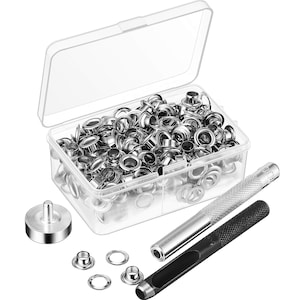 May include: A clear plastic box filled with silver metal eyelets, alongside a setting tool, a punch, and a setting die. The eyelets are small, with a circular design. The tools have silver and black handles.