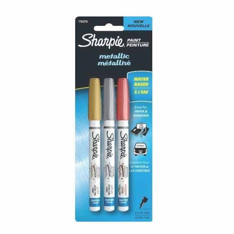 May include: Three Sharpie metallic paint markers in gold, silver, and copper. The markers are water-based and great for paper and windows. The packaging says "New" and "Metallic".