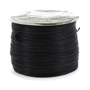 May include: A spool of black waxed cord for crafts. The spool is labeled "Mandala Crafts" and has a toll-free number.