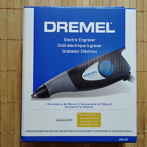 Grabadora Dremel de 0,2 amperios y 7200 golpes por minuto para metal, vidrio, madera, plástico y cerámica. Incluye plantilla de letras y números y punta de grabado