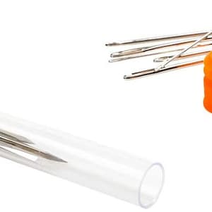 May include: A set of 10 silver sewing needles in a clear plastic tube with an orange cap. The needles are arranged in a bundle and are ready for use.