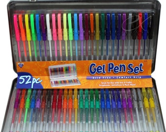 May include: A set of 52 gel pens in a silver carrying case. The pens are arranged in rows and have a variety of colors, including neon, metallic, and glitter. The case has a label that says "Gel Pen Set" and "Acid Free - Comfort Grip".