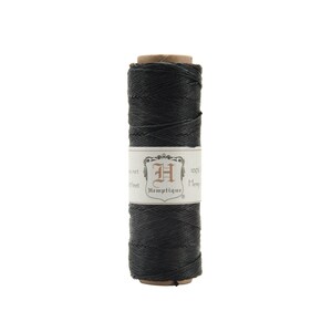 May include: A spool of black 100% hemp twine, labeled "Hemptique" with a crest featuring the letter "H".