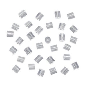 May include: A scattering of clear plastic earring backs, designed to secure earrings in place.