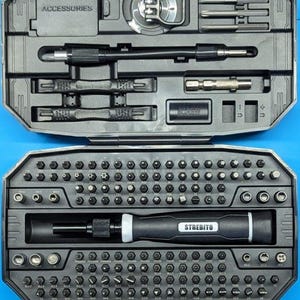 Könnte beinhalten: Ein schwarzes und graues Schraubendreher-Set mit mehreren Bits und Zubehör. Das Set enthält einen Griff, Verlängerungsstangen und verschiedene Schraubendreherköpfe. Das Gehäuse ist mit "ACCESSORIES" und "STREBITO" beschriftet.