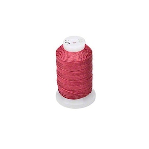 May include: A spool of red thread, suitable for sewing and craft projects. The thread is tightly wound around a white plastic spool. The spool has the number "331" printed on the top.