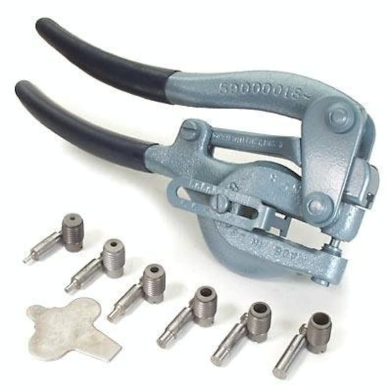 May include: A gray metal punch tool with two handles and a set of eight metal punch tips. The tool is labeled "59000001S".
