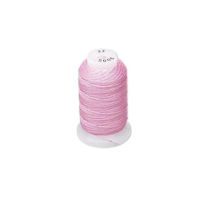 May include: A spool of pink thread with the number 5005 and the letter "F" printed on the spool.