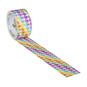 May include: A roll of Duck Tape with a colorful houndstooth pattern in shades of yellow, orange, pink, purple, and blue. The tape is on a white background.