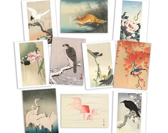 May include: A set of nine vintage Japanese woodblock prints featuring various animals and plants. The prints are framed in white and have a traditional Japanese aesthetic.