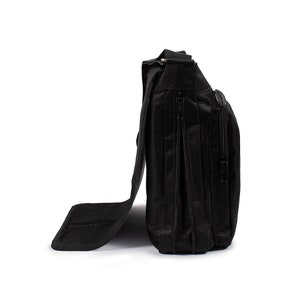 May include: A black messenger bag shown from the side profile, featuring a textured fabric construction, a long flap closure, multiple vertical zippered compartments, and an adjustable shoulder strap attached to the top of the bag structure.