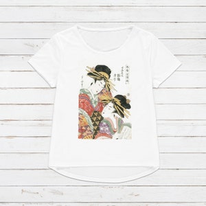 May include: White t-shirt with a colorful Japanese woodblock print of two women in traditional clothing. The text on the shirt reads "Early Edo Period,  Famous courtesan"