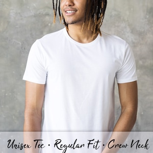 May include: A white unisex crew neck t-shirt with a regular fit. The t-shirt is made of a soft, comfortable fabric and is perfect for everyday wear.