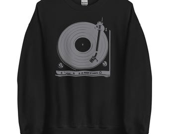 May include: Black sweatshirt with a grey graphic of a record player with the text "Keep It Vinyl".