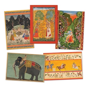 May include: A collection of five rectangular art prints featuring traditional Indian miniature paintings. The scenes depict figures in vibrant clothing, a large elephant with decorative trappings, and riders on horseback, all framed by ornate borders.