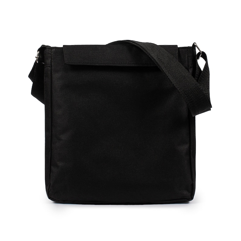 May include: A solid black rectangular messenger bag featuring a fold-over flap closure, a wide adjustable shoulder strap attached with silver-toned metal hardware, and a structured vertical orientation with clean, minimalist stitching throughout.