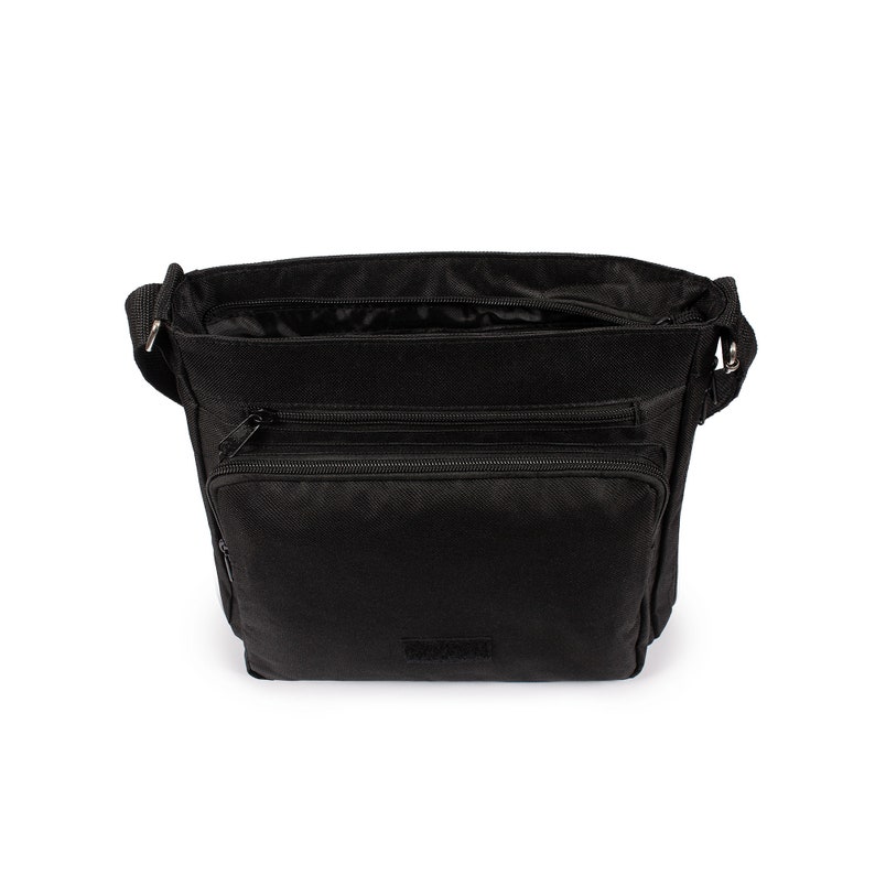 May include: A black crossbody bag featuring a main zippered compartment, a secondary zippered front pocket, and an additional smaller zippered pocket on the front. The bag includes an adjustable shoulder strap attached with silver-toned metal hardware.
