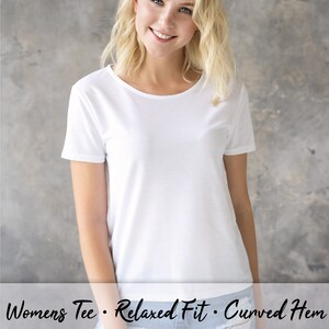 May include: White short-sleeved t-shirt with a relaxed fit and curved hem. The t-shirt is made of a soft, comfortable fabric and is perfect for everyday wear. Womens Tee. Relaxed Fit. Curved Hem.