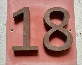 House number "18" of stone