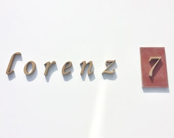 Numbers and letters made of sandstone