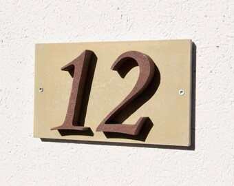 House number "12" of stone