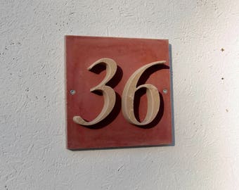 House number "36" of stone