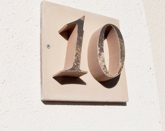 House number "10" of stone