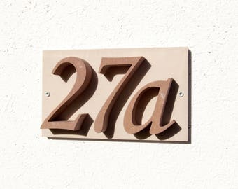 House number "27a" of stone
