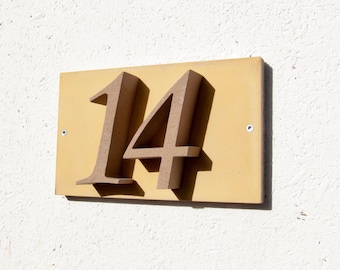 House number "14" of stone