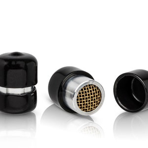 May include: Three black plastic caps with a silver and gold mesh filter. The caps are designed to fit on the end of a pipe or tube.