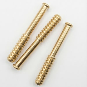 May include: Three gold-colored metal rods with a cylindrical design. Two rods have a threaded section in the middle, while the third has a smooth surface. The rods are arranged diagonally against a white background.