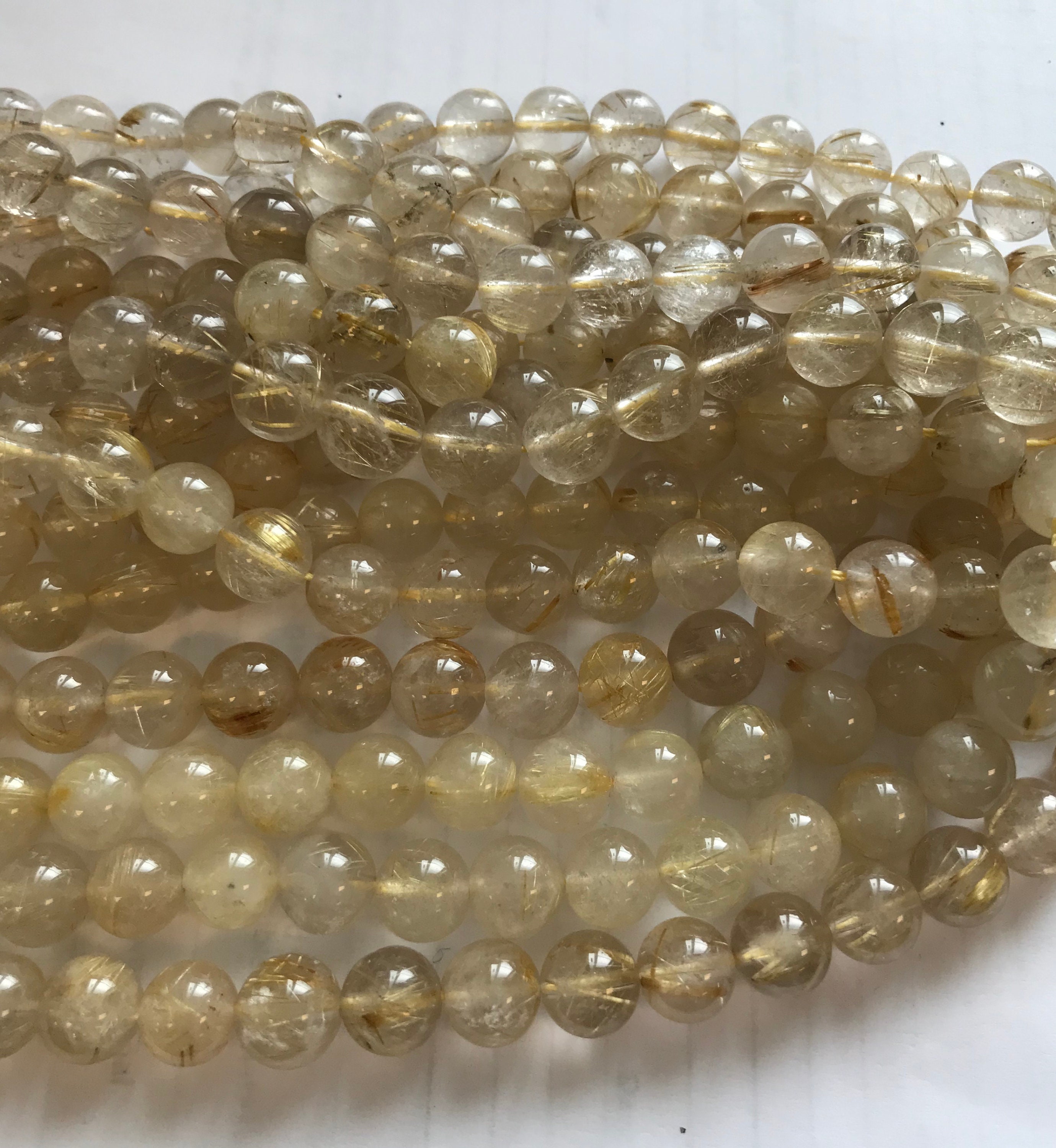 NATURAL RUTILATED QUARTZ ROUND 14mm FACETED BEADS 15" STRAND NATURAL RUTILATED QUARTZ ROUND 14mm FACETED BEADS 15" STRAND