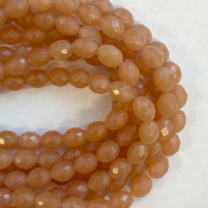 Peach Jade 12x10mm Faceted Oval Gemstone Beads -- 15.5 inch strand
