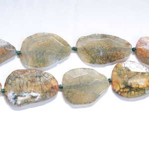 50mm x 34mm Fire Agate Faceted Irregular Shaped Gemstone Bead -15 inch strand