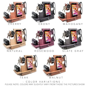 May include: Wooden desk organizer in various colors: cherry, ebony, mahogany, natural, rosewood, slate gray, teak, and walnut. Each organizer holds a phone, watch, keys, wallet, and glasses. The text at the bottom reads "COLOR VARIATIONS - PLEASE NOTE: COLORS MAY SLIGHTLY VARY FROM THOSE THE PICTURES SHOW."
