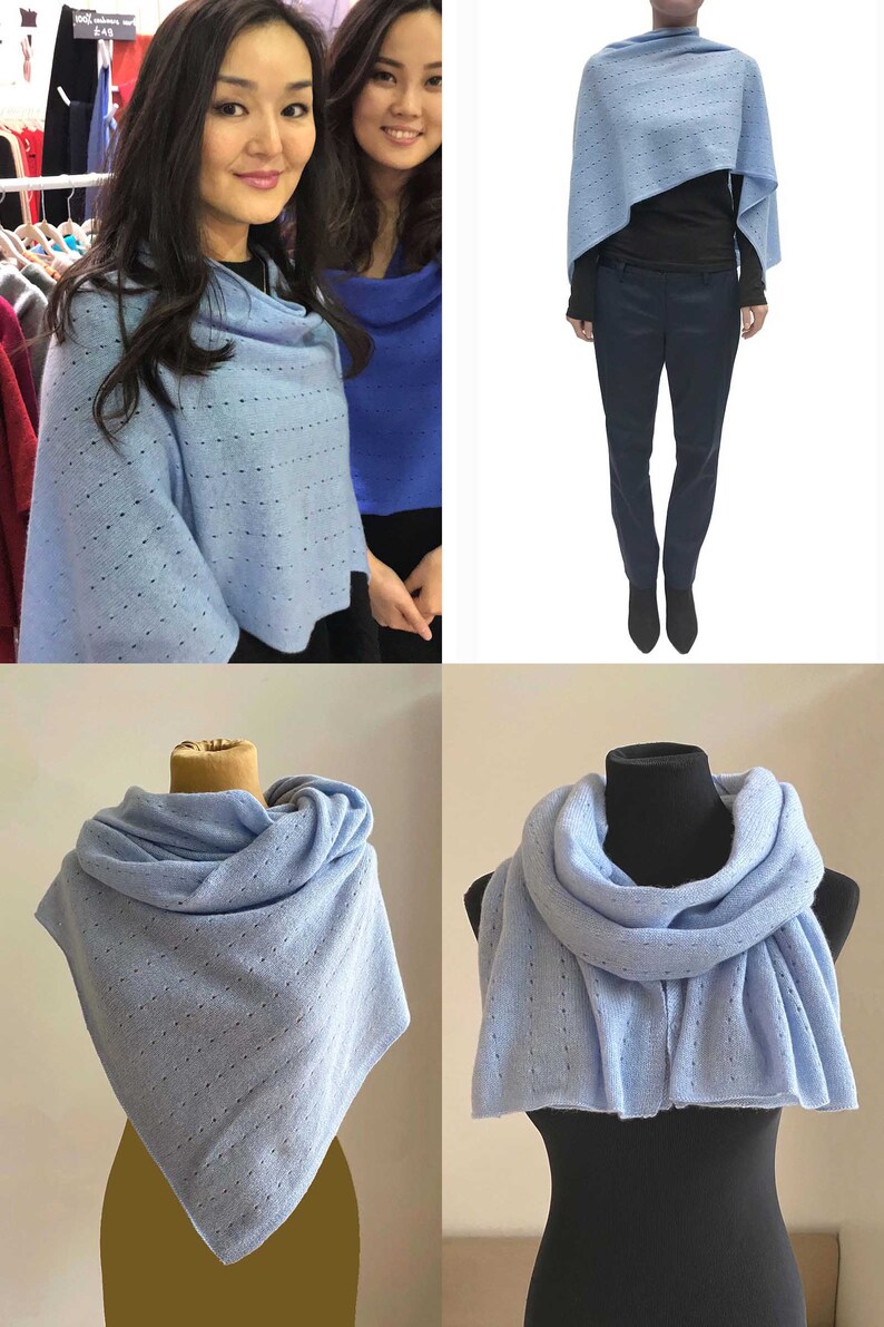 May include: A light blue knitted scarf with a delicate openwork pattern. The scarf can be worn as a shawl or wrapped around the neck.