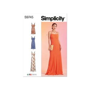 May include: Simplicity sewing pattern S9745. The pattern features three different long dresses with spaghetti straps. The image on the right shows a woman wearing a bright orange dress. The pattern is designed and printed in the USA.